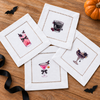 Halloween Cocktails 2 - four mini DTF transfer designs shown on white hemstitched cocktail napkins