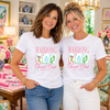 Two women wearing white tees with Mahjong Social Club transfers
