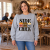 Woman wearing a grey sweatshirt with Side Chick Thanksgiving transfer