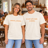 Couple wearing ivory tees with orange sweet potato and kind of rude potato designs