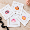 Girlie Halloween Pumpkins Set 3 — mini pumpkin transfers on white hemstitched cocktail napkins
