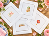 Mahjong Lucky Tiles: four designs on white hemstitched cocktail napkins