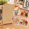 Four blank taupe hemstitched guest towels and four included ready-to-press designs