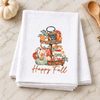 Happy Fall Tiered Tray transfer on a folded white towel in a fall kitchen