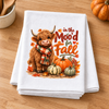 In the Mood for Fall Highland Cow transfer on a folded white kitchen towel
