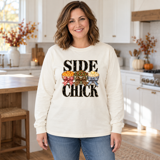 Woman wearing an ivory long-sleeve tee with Side Chick Thanksgiving transfer