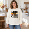 Woman wearing an ivory long-sleeve tee with Side Chick Thanksgiving transfer
