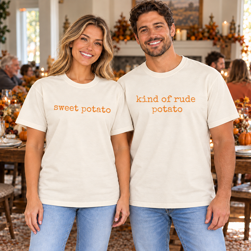 Couple wearing ivory tees with orange sweet potato and kind of rude potato designs