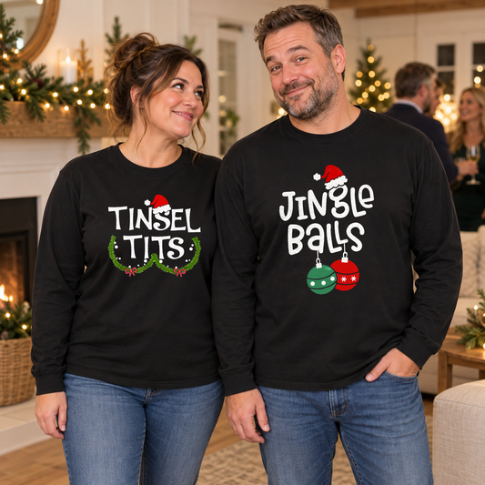 Couple wearing Tinsel Tits and Jingle Balls designs on black long-sleeve tees at a Christmas party