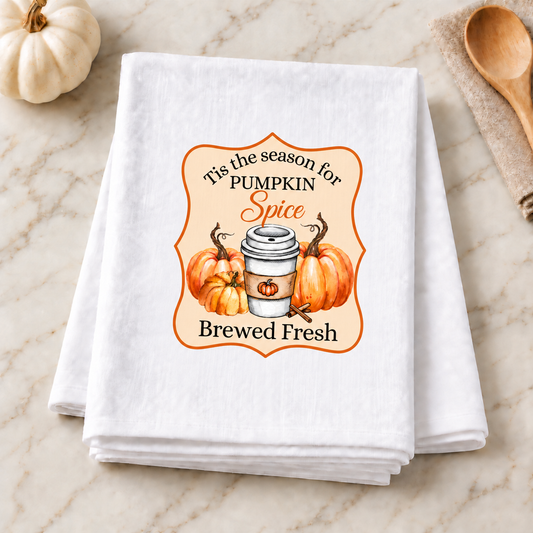 Tis The Season For Pumpkin Spice design on folded white towel in a neutral fall kitchen scene